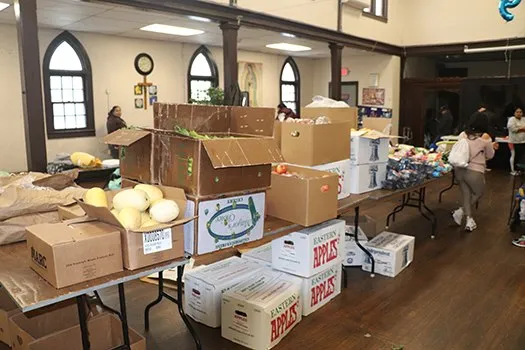Boxes of fresh produce and groceries in the St. Brigid's pantry hall.